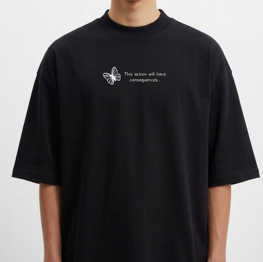 Camiseta com estampa frontal de borboleta acompanhada da frase "This action will have consequences..." em fonte simples e pequena.