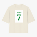 Camiseta com estampa frontal de nome "Paulo" acima do número "7", ambos em fonte estilizada, sugerindo uma temática esportiva ou personalizada.
