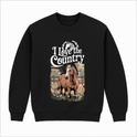 Moletom com estampa frontal de cavalo em ambiente rural, cercado por folhagens e estrutura de madeira, acompanhado da frase "I Love the Country" no topo.
