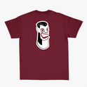 Camiseta com estampa frontal de letras estilizadas "Carranca & Labs" e estampa traseira de um desenho gráfico de figura caricata com expressão marcante.
