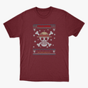 Camiseta com estampa frontal de caveira estilizada com chapéu, ossos cruzados, flocos de neve, pequenos crânios e a frase "Feliz Natal" acima.