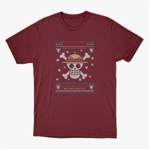 Camiseta com estampa frontal de caveira estilizada com chapéu, ossos cruzados, flocos de neve, pequenos crânios e a frase "Feliz Natal" acima.