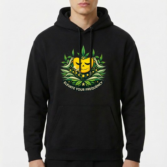 Moletom com estampa frontal de uma figura central amarela sorridente, cercada por folhas verdes e detalhes florais, com o texto "Elevate Your Frequency".