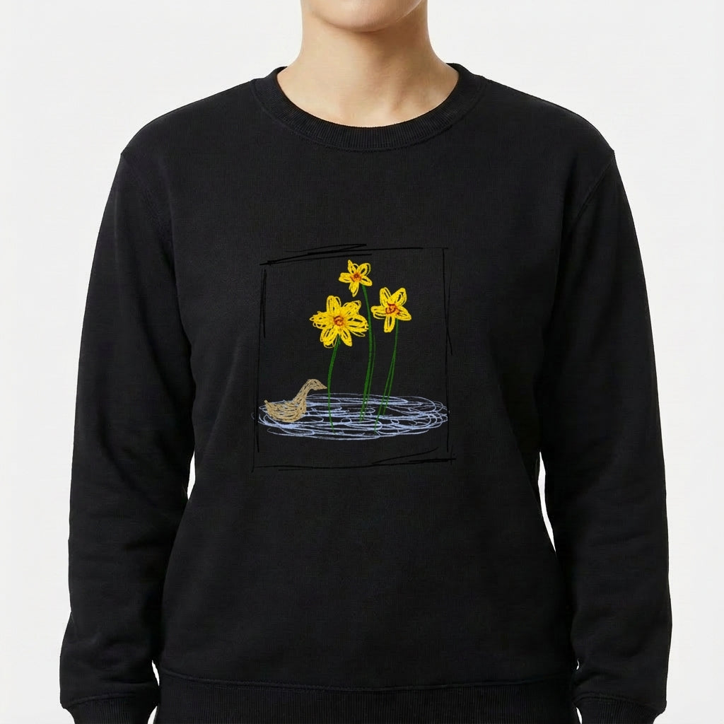 Moletom com estampa frontal de flores detalhadas sobre um lago, com um pássaro próximo à margem, compondo um cenário natural harmonioso.