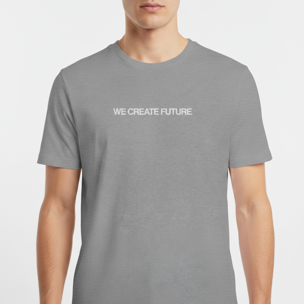 Camiseta com estampa frontal de texto "WE CREATE FUTURE" em fonte clara e estampa traseira com pequeno logotipo estilizado no topo central.