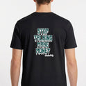 Camiseta com estampa traseira de letras gotejantes formando a frase "STOP TALKING MAKE MONEY", e assinatura estilizada "Hustlers Only" abaixo.