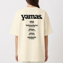 Camiseta com estampa frontal de "asteya" e "NÃO ROUBAR" e estampa traseira de "yamas" com lista de palavras como "satya", "brahmacharya", "ahimsa", "asteya" e "aparigraha".